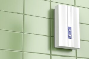 tankless-water-heater-mounted-on-green-wall