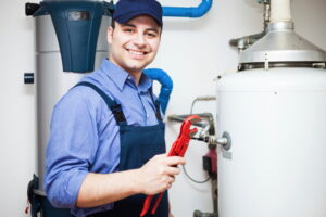 Portrait of a smiling plumber at work